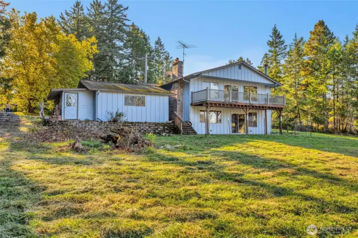 Sunlit back yard lets you see just how large that deck really is