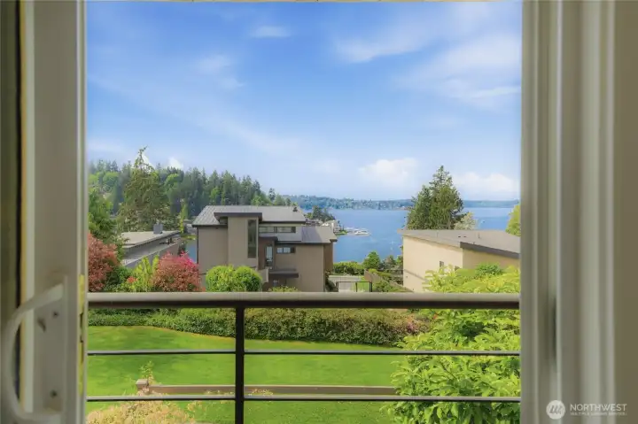 French doors open from the primary suite directly onto the lake-view balcony, revealing Lake Washington, and the marina.The view that greets you every morning without ever leaving your room.