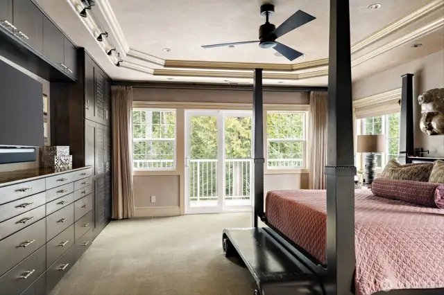 The spacious primary suite opens to the deck, offering ultimate privacy while being bathed in abundant natural light