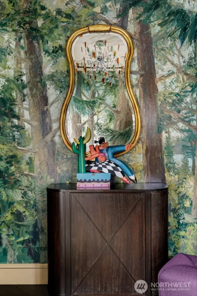 This home is showcased by an impressive 80-foot mural, hand-painted with a knife by renowned artist Jennifer Bowman, adding a distinctive touch of artistic elegance. Simply incredible!