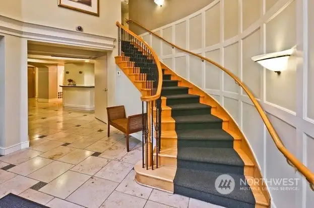 Lobby Entrance with lounge, concierge, mail boxes, elevator, and staircase