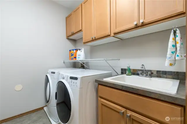 Laundry room with utility sink just off the garage