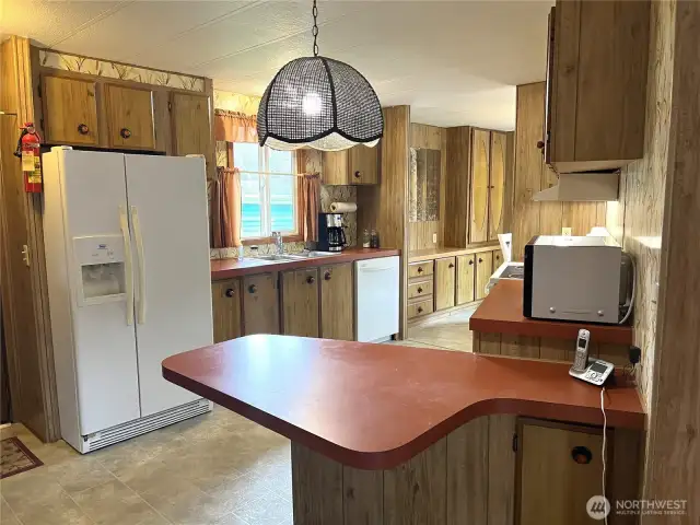 Newer appliances, dishwasher, refrigerator, and stove. Plenty of counter space.
