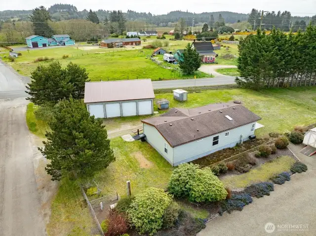 Mixed-Use Zoned 3-bedroom home and shop with a fully fenced .31 acre yard has a 1200 square foot 4 bay shop with a 100 amp service for all your toys or projects, plus an RV hookup
