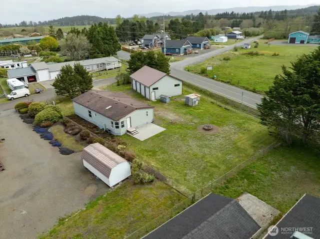 Mixed-Use Zoned 3-bedroom home and shop with a fully fenced .31 acre yard has a 1200 square foot 4 bay shop with a 100 amp service for all your toys or projects, plus an RV hookup