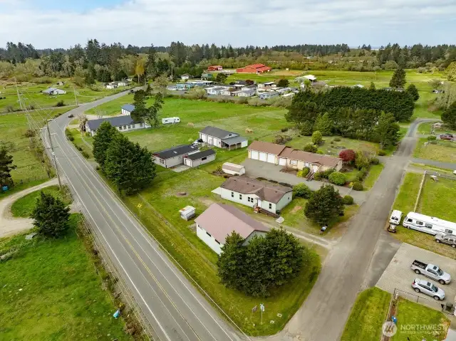Mixed-Use Zoned 3-bedroom home and shop with a fully fenced .31 acre yard has a 1200 square foot 4 bay shop with a 100 amp service for all your toys or projects, plus an RV hookup