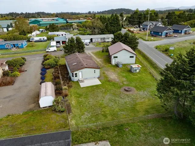 Mixed-Use Zoned 3-bedroom home and shop with a fully fenced .31 acre yard has a 1200 square foot 4 bay shop with a 100 amp service for all your toys or projects, plus an RV hookup