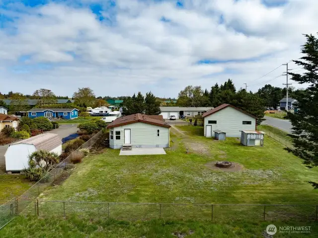 Mixed-Use Zoned 3-bedroom home and shop with a fully fenced .31 acre yard has a 1200 square foot 4 bay shop with a 100 amp service for all your toys or projects, plus an RV hookup