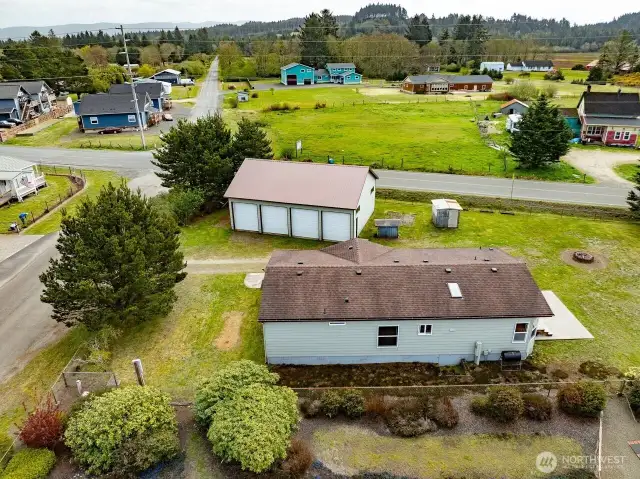 Mixed-Use Zoned 3-bedroom home and shop with a fully fenced .31 acre yard has a 1200 square foot 4 bay shop with a 100 amp service for all your toys or projects, plus an RV hookup