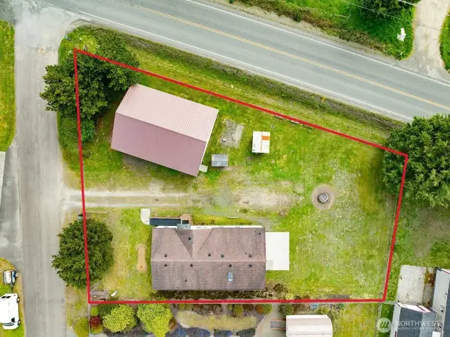 Mixed-Use Zoned 3-bedroom home and shop with a fully fenced .31 acre yard has a 1200 square foot 4 bay shop with a 100 amp service for all your toys or projects, plus an RV hookup