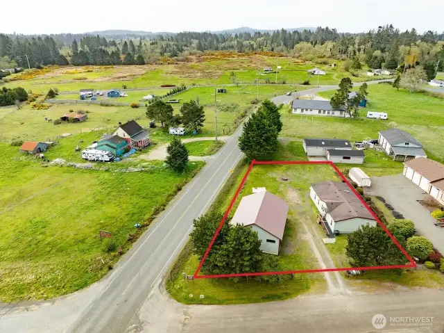 Mixed-Use Zoned 3-bedroom home and shop with a fully fenced .31 acre yard has a 1200 square foot 4 bay shop with a 100 amp service for all your toys or projects, plus an RV hookup