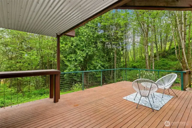 The deck is partially covered and dry, making it perfect for year-round BBQing.