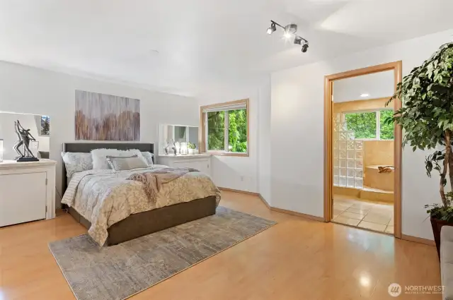Your spacious primary features built-ins and a gorgeous en suite. Wake up to the birds each morning!