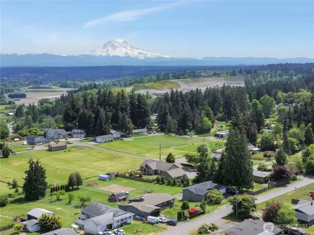 Aerial view from property. Home has partial mountain view and great view of cascade mountain range and Puyallup valley