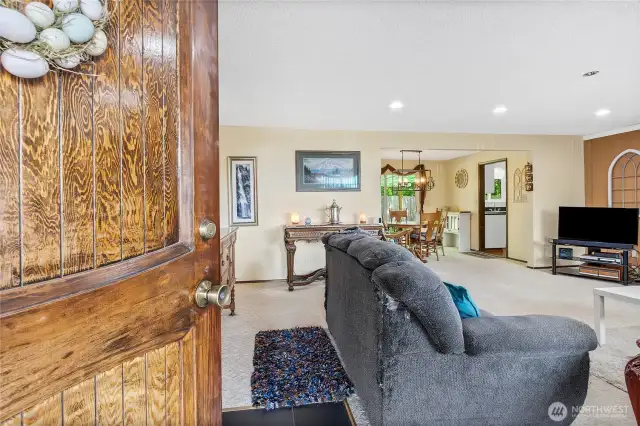Entering Front door into spacious family room, open concept.