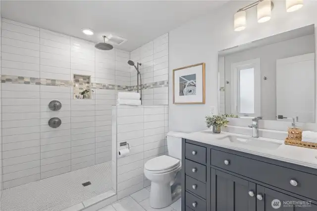 Primary bath with walk-in tile shower.
