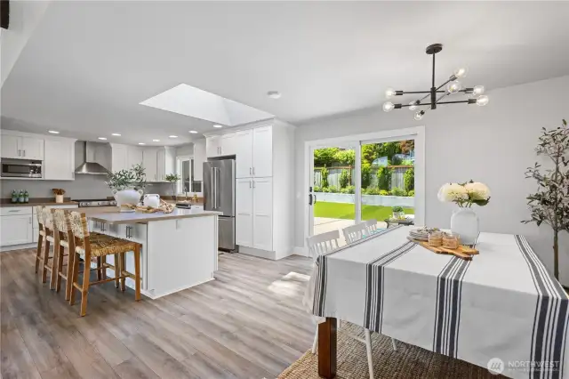 The kitchen and dining area offer a mix of casual and more formal dining options.