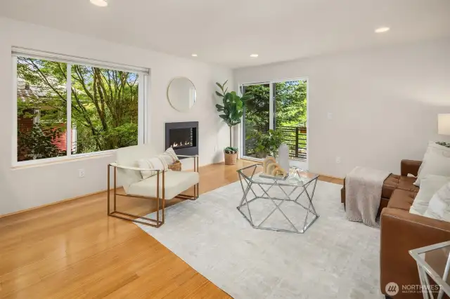 Living Room w Gas Fireplace Surrounded by Nature