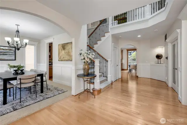 The grand entrance is bathed in natural light, thanks to west-facing windows and a skylight that fills the space with warmth and brightness from the moment you step inside.