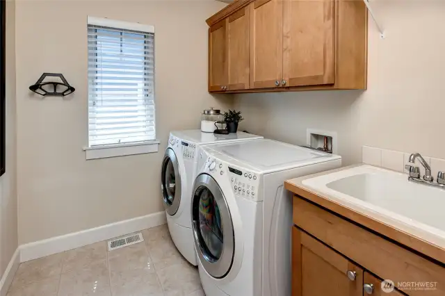 The upstairs laundry room offers everyday convenience with easy access from all bedrooms—making laundry day a breeze.