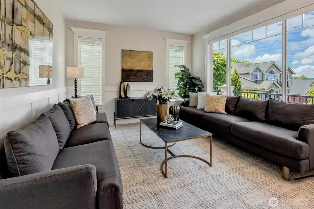 The formal living room offers an intimate setting with picture windows that frame stunning mountain and territorial views.