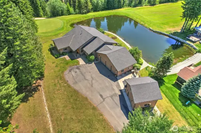 Home is situated on the 18th green and is protected by a wrap around pond.