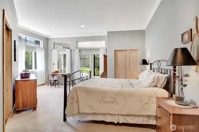 The primary suite is spacious and has it's own private entrance to the screened porch.