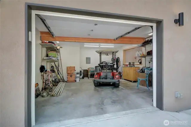 Golf cart garage has lots of space AND a dog washing facility.