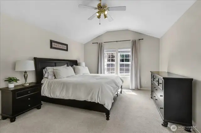 Primary Bedroom with French doors to Private Deck. Has 5 Piece Primary Bathroom Suite complete with Glass Surround Shower, Jetted Soaking Tub, and His & Her Sinks with walk In Closet