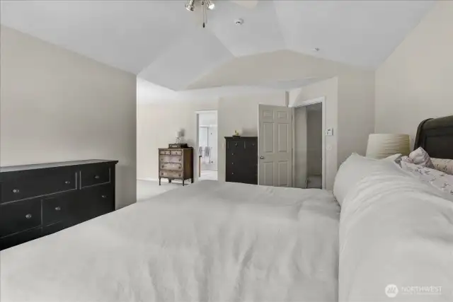 Primary Bedroom with French doors to Private Deck. Has 5 Piece Primary Bathroom Suite complete with Glass Surround Shower, Jetted Soaking Tub, and His & Her Sinks with walk In Closet