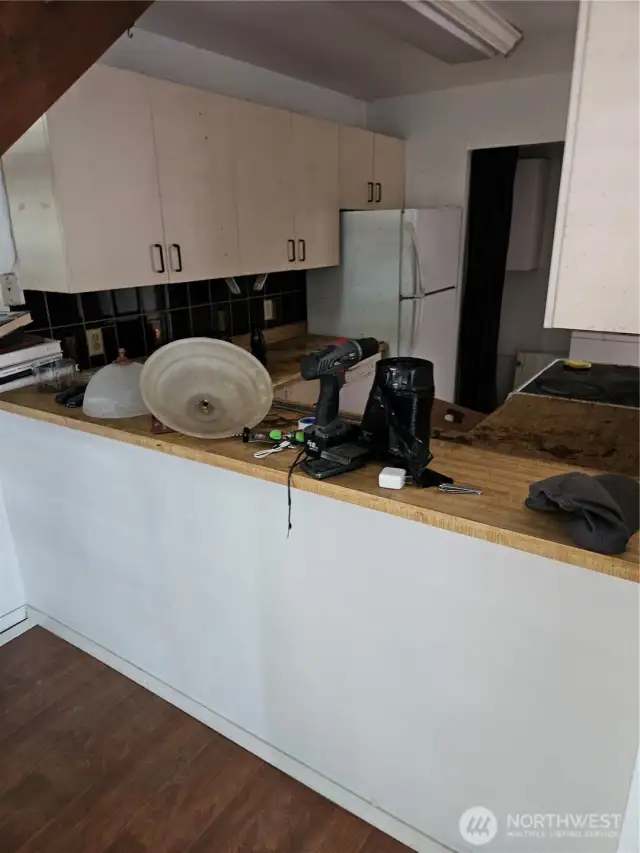 Kitchen with Dining Bar Needs Remodel