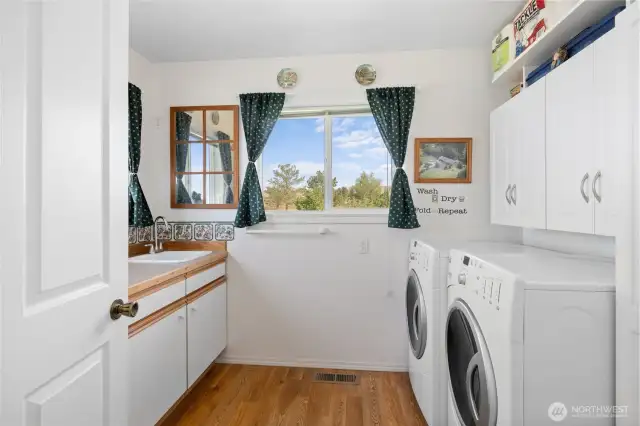 Laundry room with utility sink and MORE built in storage!