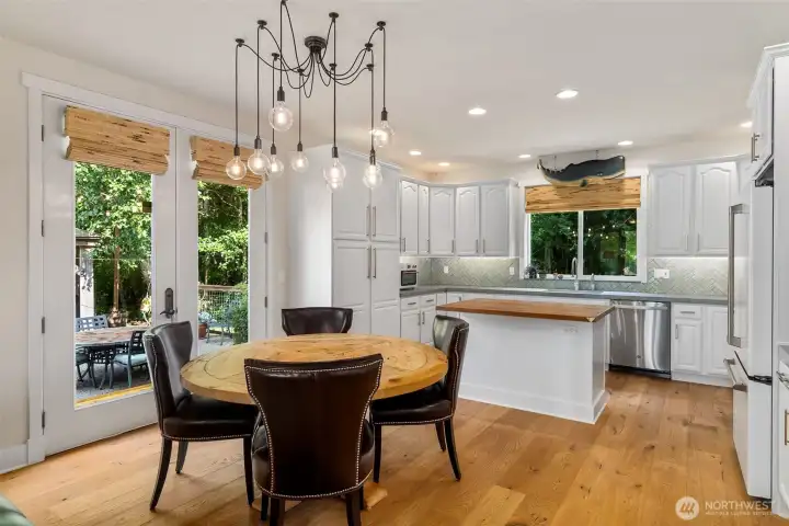 Dining space is open to the kitchen. Island has space for several bar stools for even more informal dining options