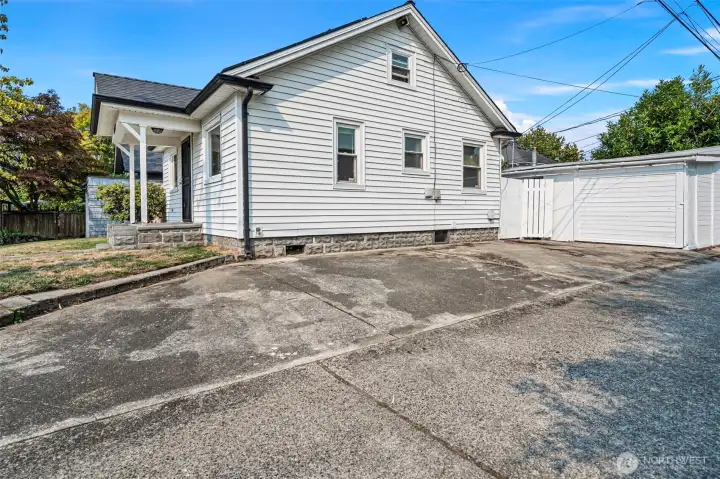 One car detached garage with parking pad off the alley
