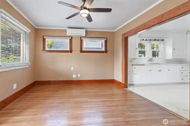 Living room with original fir floors and ductless heat pump
