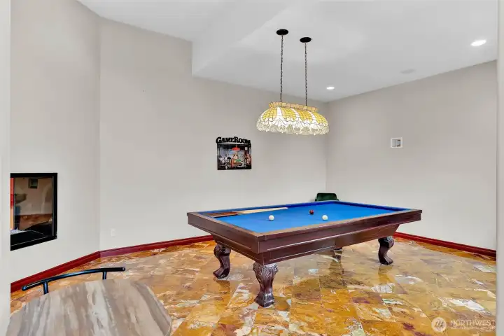 Game room with see - through gas fireplace