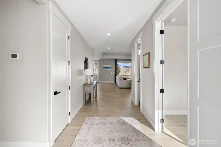 Wide entry with two bedrooms to the left, office to the right.