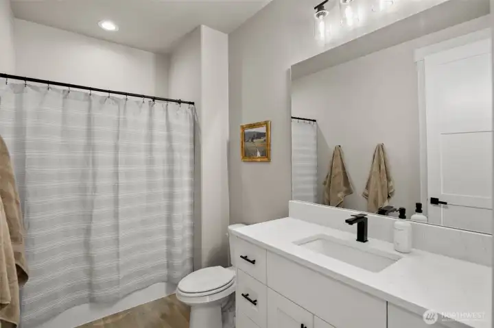 Full bathroom located between 1st & 2nd bedrooms. Featuring a linen closet.