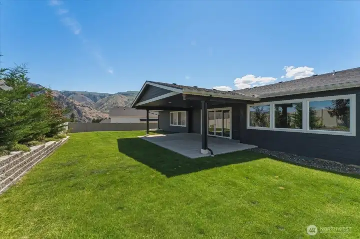 Backyard is fully fenced with gates on each side of the house.