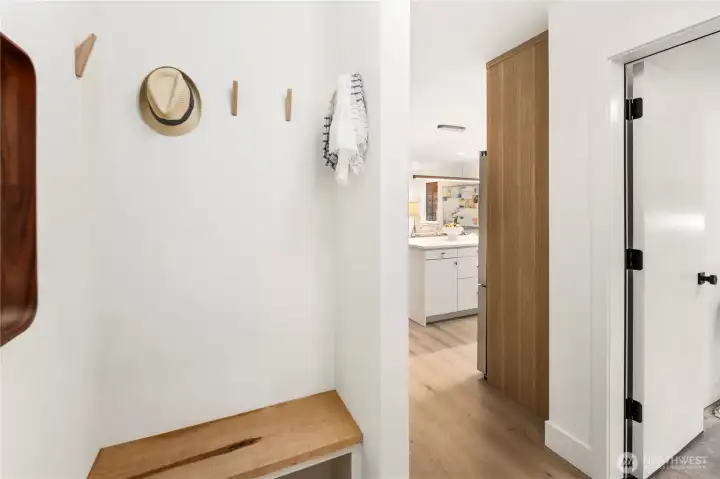 Formal entry includes seating area with easy access to the flex room