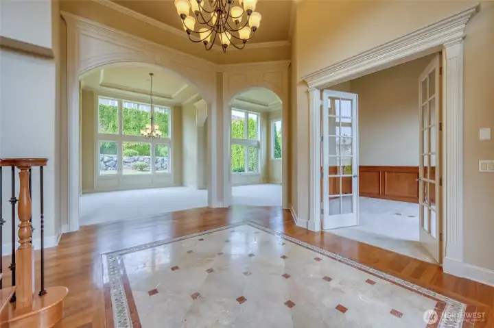Den/library with beautiful wood wainscotting to the right.