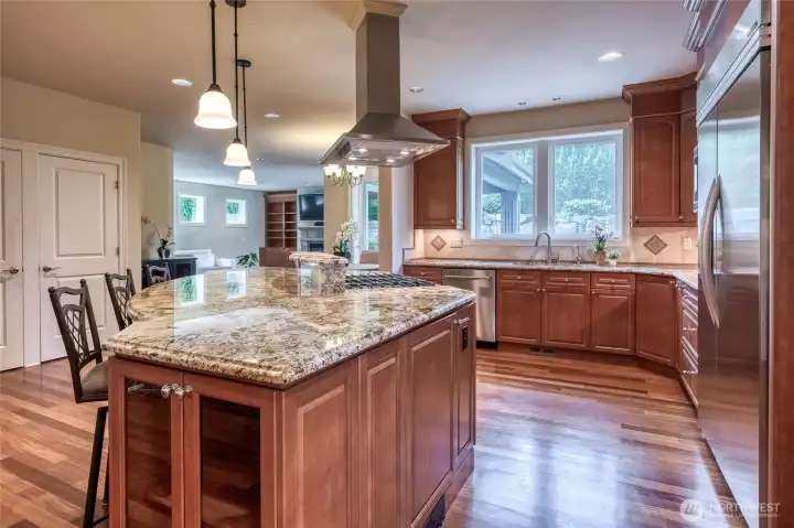 Chef's kitchen with extra large eating island. Beautiful granite slab countertops, bullnose edge.