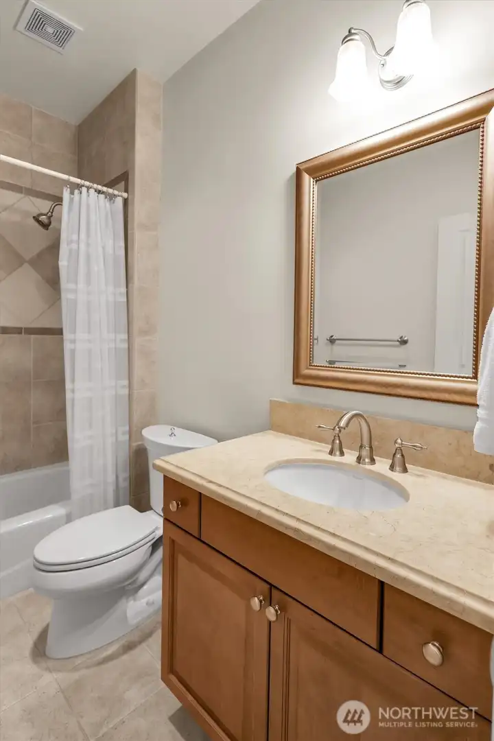 One of the 4 bathrooms upstairs.