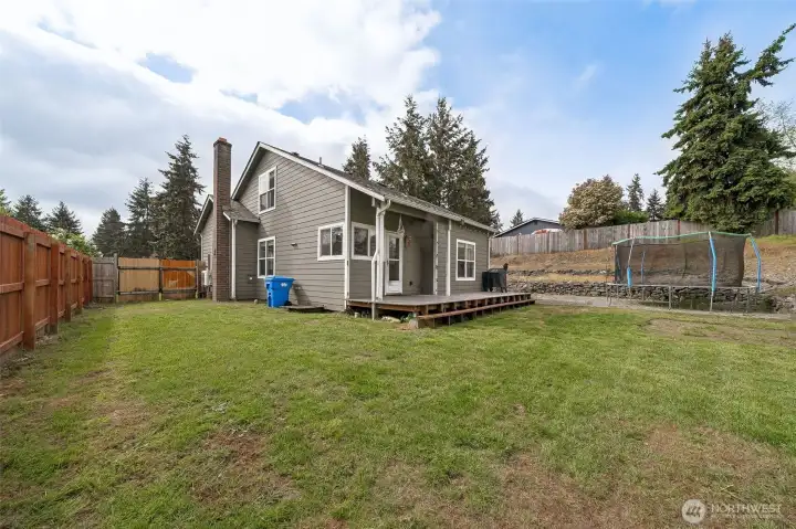 Backyard is fully fenced. Notice the gate for access to the back yard.