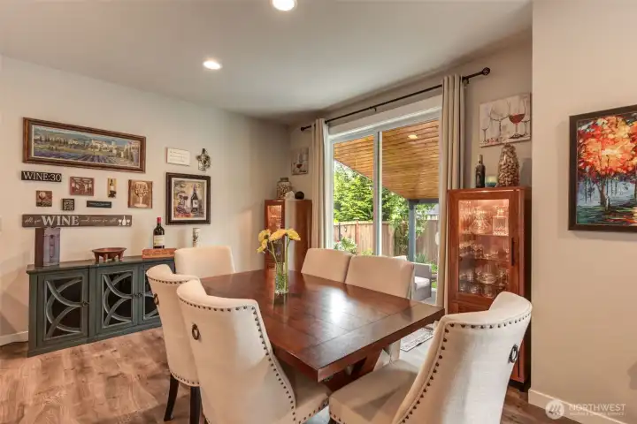 Spacious dining area perfectly situated between kitchen and back patio. Spacious dining area perfectly situated between kitchen and back patio.