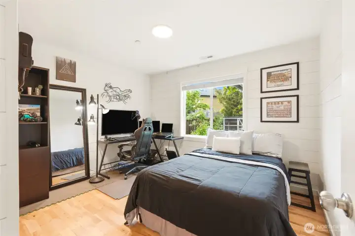 Main floor bedroom, with an adjacent full bathroom Main floor bedroom, with an adjacent full bathroom