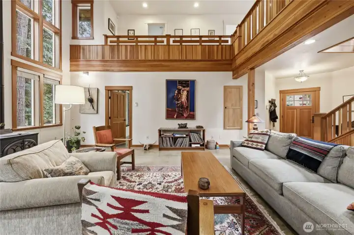 Primary bedroom on the main floor on the left. Front door and stairs to the second story to the right