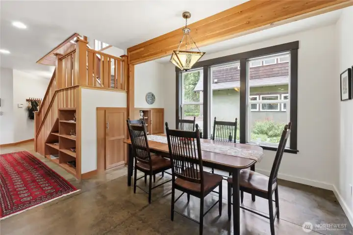 Dining nook with storage under the stairs.