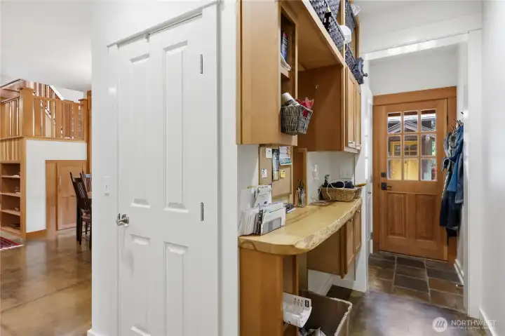 Behind this door is a large walk-in pantry.