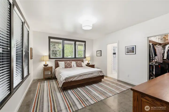 Main floor primary bedroom. Spacious with lots of windows.